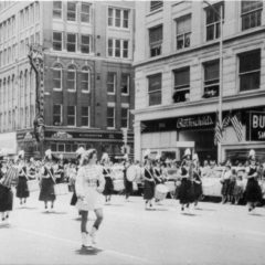 (CHS.2011.01.29) - Central High School Band Marching in Parade through Intersection of Main and Harvey, c. late 1950s 