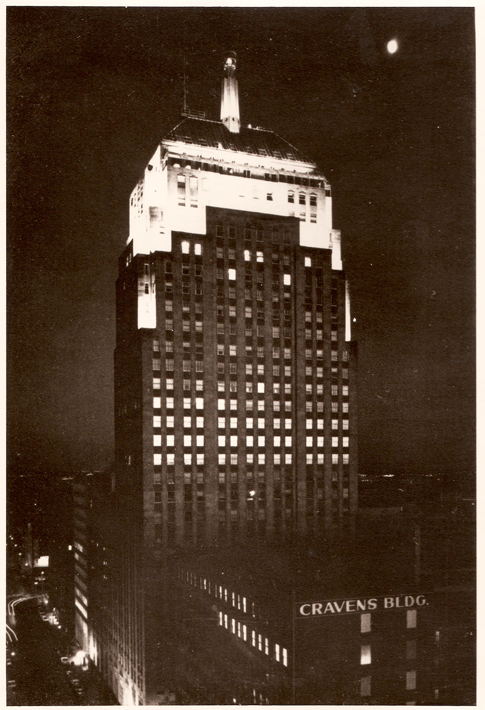 (FNB.2010.16.11) - First National Building Illuminated at Night, View Southeast possibly from Fidelity Bank Tower, c. late 1950s