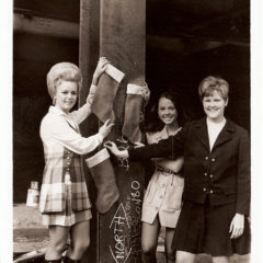 (FNB.2010.12.20) - Women Hanging Christmas Stockings at Construction Site, First National Center, c. 1970