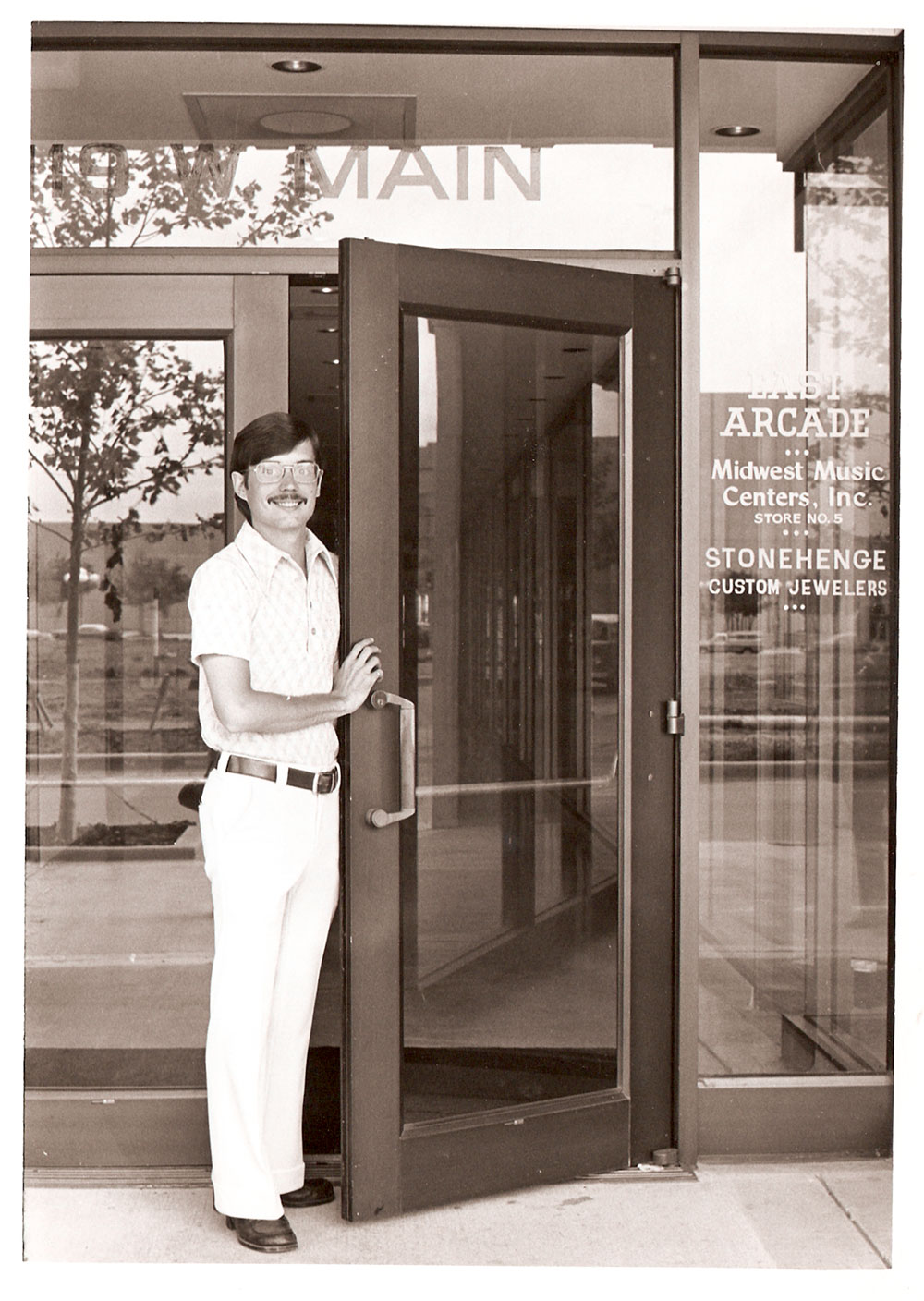 (FNB.2010.12.39) - Jim Morgan at South Entrance to the East Arcade, First National Center, c. 1970