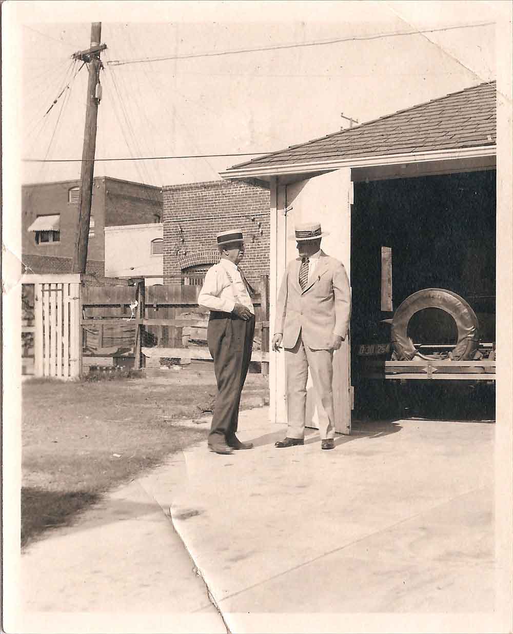 (HTC.2010.8.12) - Two Men Converse near a Garage, c. 1920s