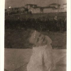(HTC.2010.8.15) - Hightower Child (probably Frank) on the Drive of 409 NW 21, View Northeast of 300 Block of NW 22, c. 1926