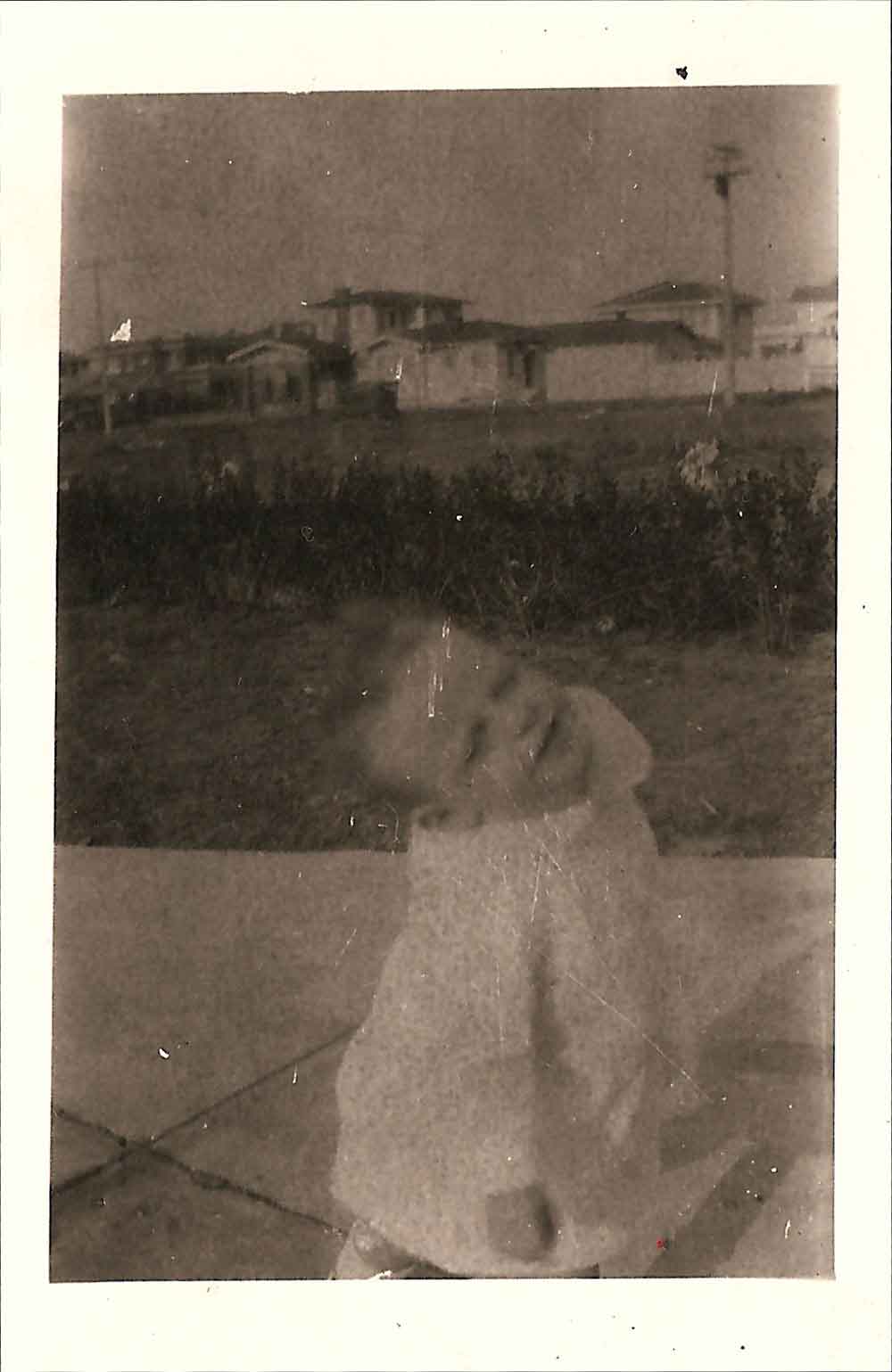 (HTC.2010.8.15) - Hightower Child (probably Frank) on the Drive of 409 NW 21, View Northeast of 300 Block of NW 22, c. 1926