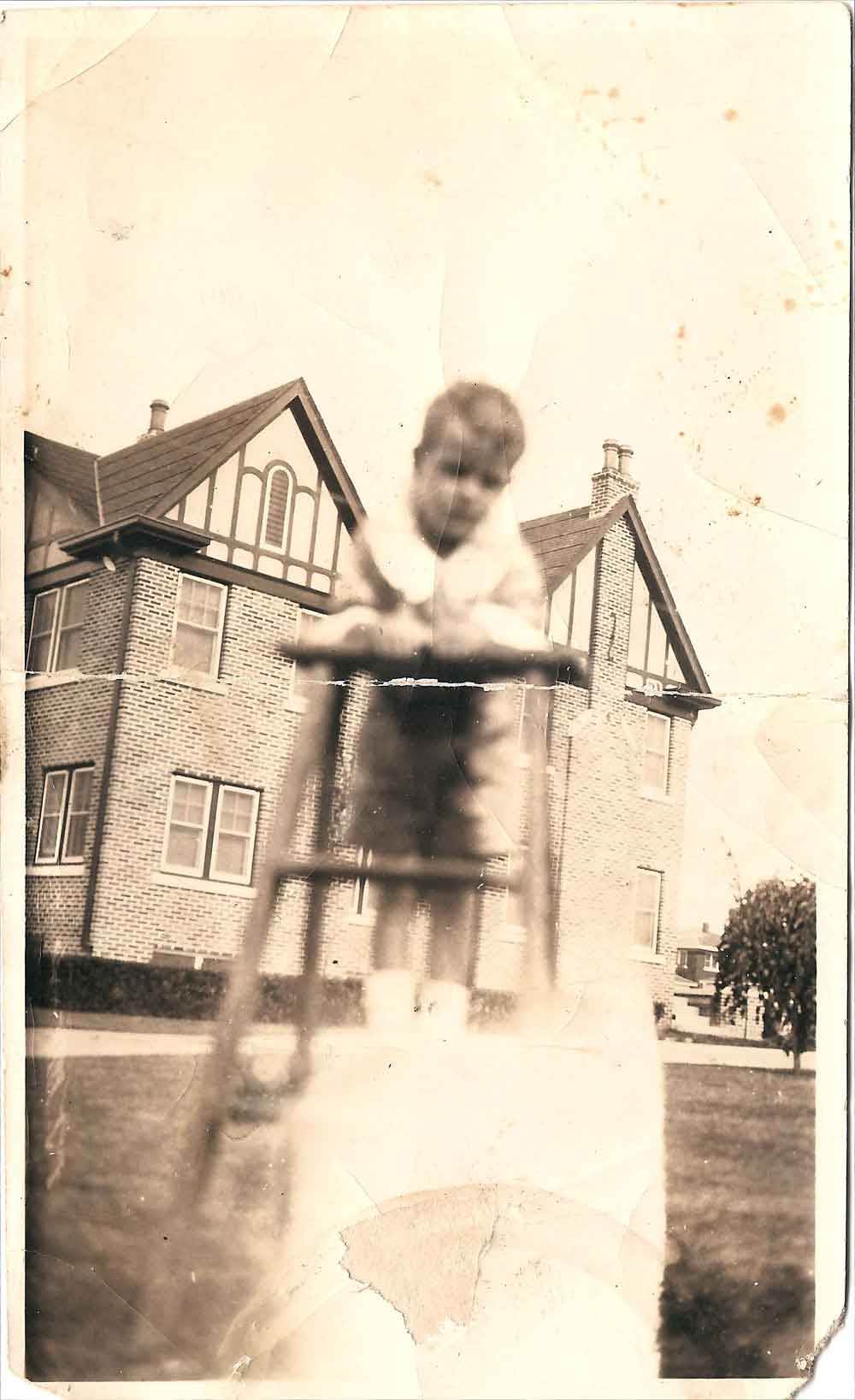 (HTC.2010.8.33) - Frank Hightower on Lawn of 409 NW 21 (2203 N Hudson in background), c. 1927
