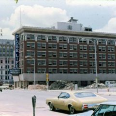 (KMC.2011.1.28) - Globe Life Building, 311 W Sheridan, View NW from Sheridan and Harvey, c.1975
