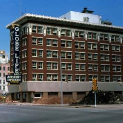 (KMC.2011.1.29) - Globe Life Building, 311 W Sheridan, View NW from Sheridan and Harvey, c.1975