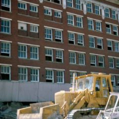 (KMC.2011.2.03) - Demolition Equipment Outside Globe Life Building, 311 W Sheridan, c.1975