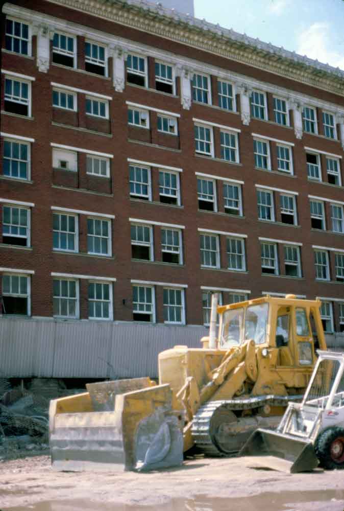 (KMC.2011.2.03) - Demolition Equipment Outside Globe Life Building, 311 W Sheridan, c.1975