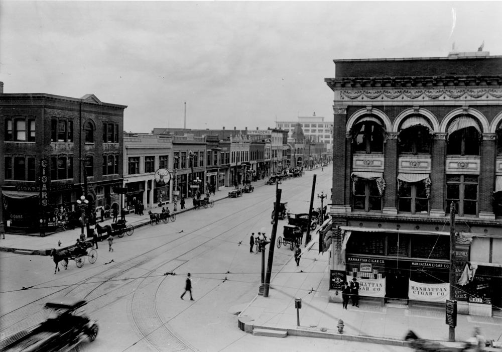 (CHS.2011.01.86) - View SW Across Intersection of Main and Grand, c. 1905
