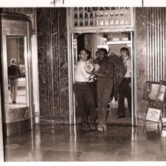 (FNB.2010.2.08) - Christmas Tree Carried in West Entrance of First National Center, c. 1974