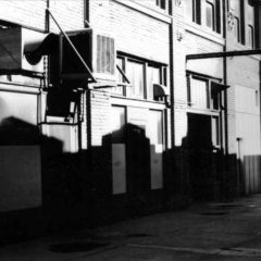 (RAC.2010.07.127) - View East toward Harvey from Alley between Main and Sheridan, c. 1968