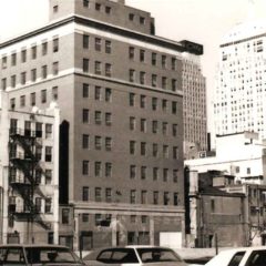 (RAC.2010.07.42) - Rear (South Side) of Equity Building (l) and Kerr's Department Store (r), 320 W Main, 1975