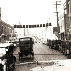 (RAC.2010.07.48) - View North on Robinson from Main, Still from Newsreel,