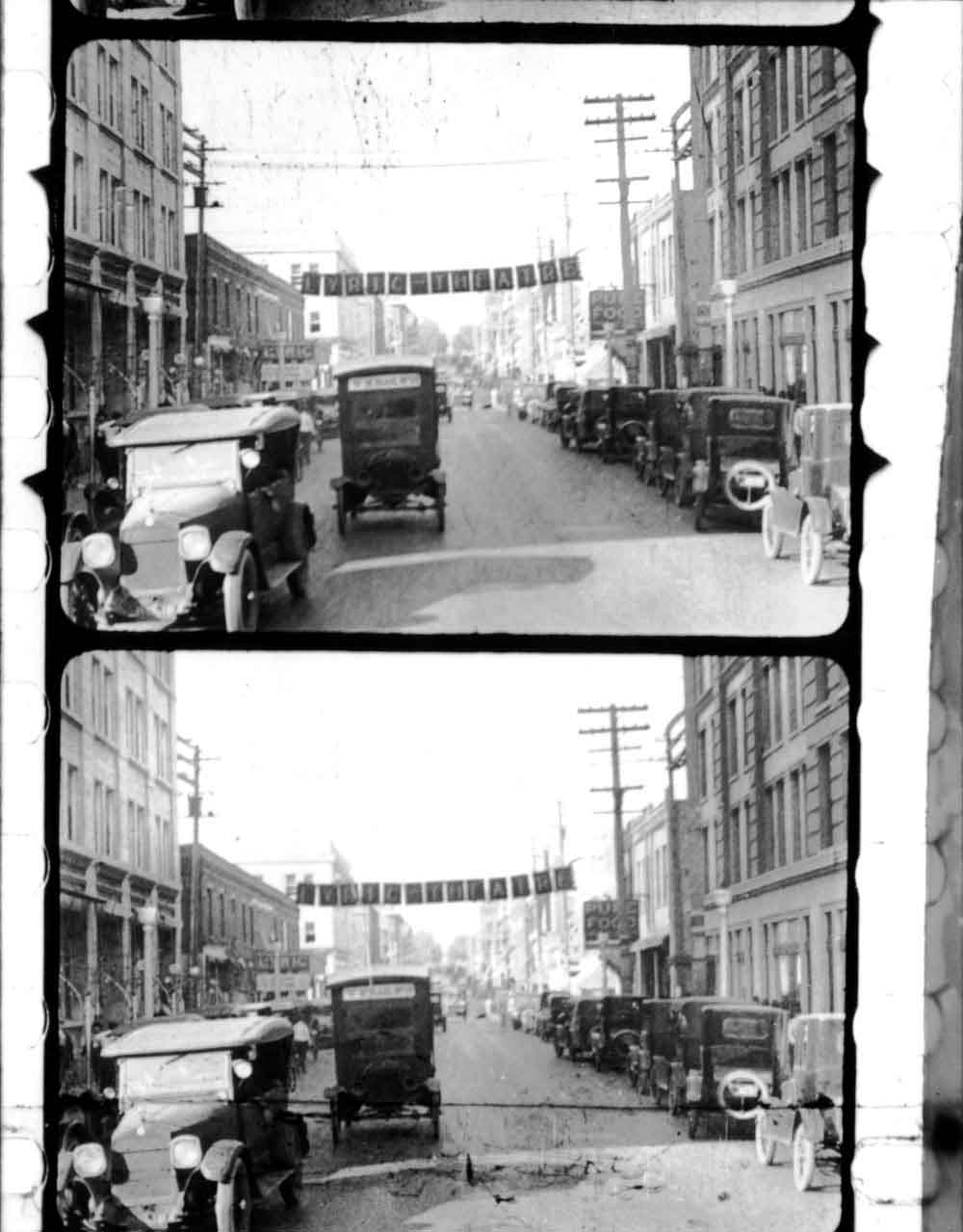 (RAC.2010.07.82) - View North on Robinson from Main, stills from 35mm newsreel,