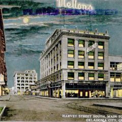 (RACp.2010.33.67) - View South on Harvey from Main at Night, c. 1910s