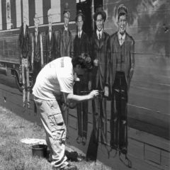 (BKT.2011.4.32) University of Central Oklahoma students paint mural on BNSF railroad elevation.