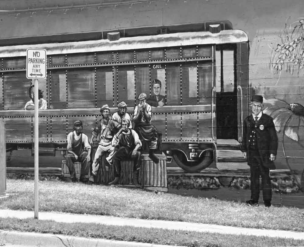 (BKT.2011.4.33) University of Central Oklahoma students paint mural on building siding the Bricktown Canal.